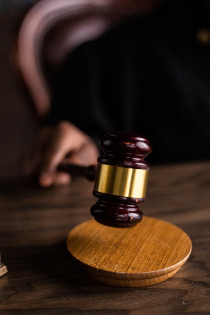 Brown and Gold Gavel on Brown Wooden Table